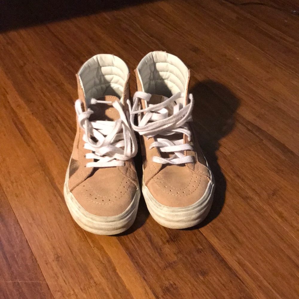 Pink and rose gold high top vans.